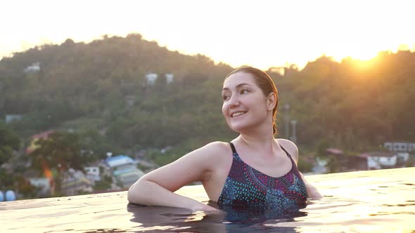 Lady in Swimsuit Admires Landscape with Forestry Hills