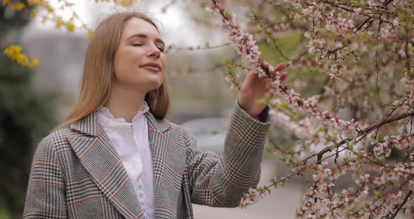 Woman Sniff Aroma of Beautiful Blossom Tree