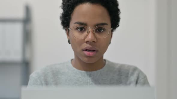 Thumbs Down By African Woman Using Laptop