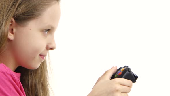 Girl Playing Video Game with Games Console. White Background, Closeup alt