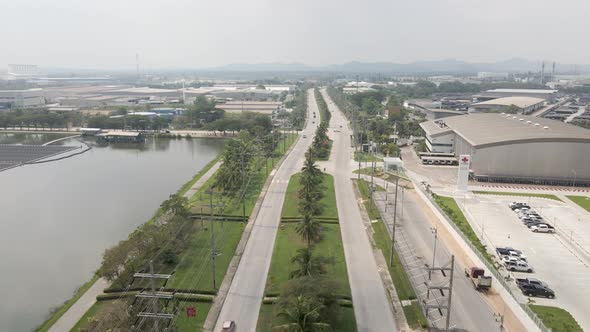 Aerial of Amata City Rayong Industrial Estate in Thailand 2 roads with traffic