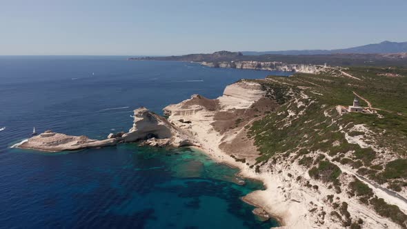 Aerial View of White Bluff Beach on Bay on the Coastline with Waves in the Blue Sea