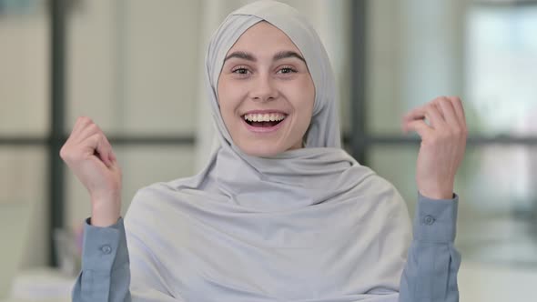 Successful Young Arab Woman Celebrating