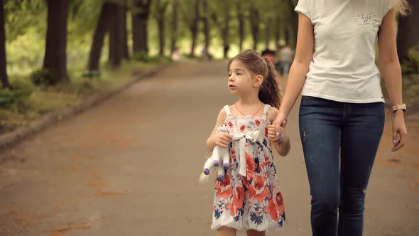 Mother's Day. Girl Holding Mother Hand.  Kid Enjoy Together With Family. Happy Children.