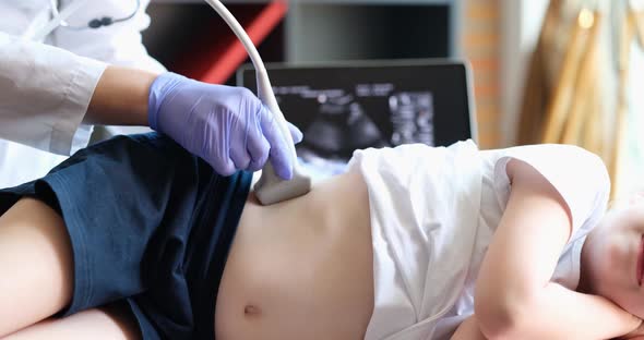 Medical Examination of Little Girl Using Ultrasound Equipment