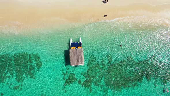 Aerial tourism of beautiful coastline beach journey by turquoise water with bright sand background o