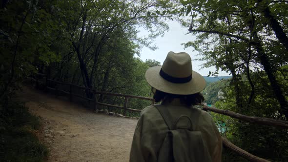 Young woman walking in the forest