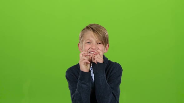 Child Boy Crossed His Fingers, He Is a Fan, but the Team Lost. Green Screen