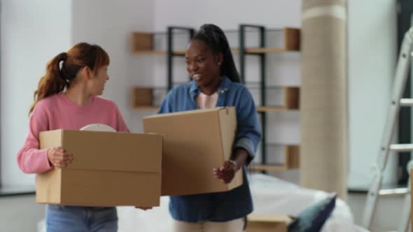 Women with Boxes Moving Out to New Home