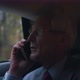 Businessman Talking on the Phone While Sitting in the Back Seat of a Car - VideoHive Item for Sale