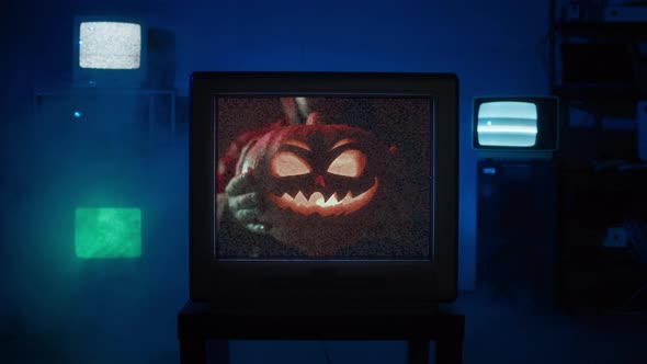 Old Tv Screen Showing Jackolantern with Glitch Effect Closeup