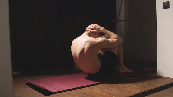 Handsome Athletic Fit Man Doing Crisscross Crunch Exercises at Home