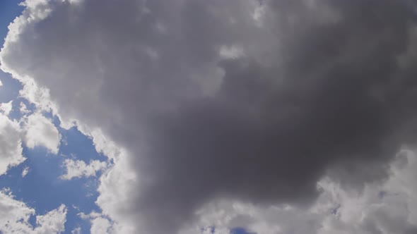 Timelapse of White Cumulus Clouds Formation with Sun Flare in the Frame Climate Change