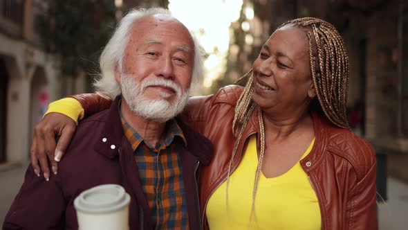 Multiracial Senior Couple Having Fun Outdoor  Travel Elderly People Concept