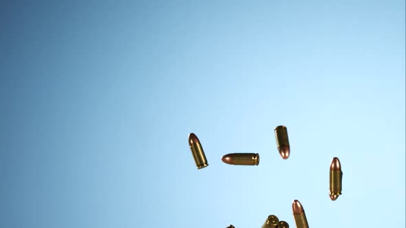 Bullets falling bouncing in ultra slow motion 1500fps on a reflective surface - BULLETS