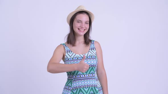 Happy Young Beautiful Tourist Woman Giving Thumbs Up