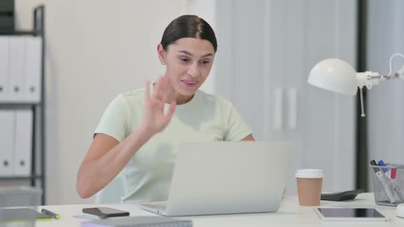 Young Latin Woman Talking on Video Chat on Laptop