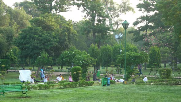 People doing yoga and meditation at Lodhi garden Delhi India in the morning time