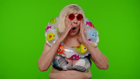 Shocked Senior Pensioner Woman Tourist in Swimsuit on Chroma Key Wow Exciting Surprise Reaction