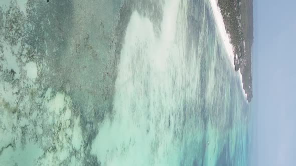 Vertical Video of the Ocean Near the Coast of Zanzibar Tanzania Aerial View