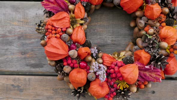 Wreath of Autumn Plants and Berries.autumn Wreath with Orange Physalis. Florist Shop