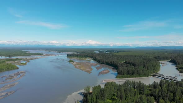 4K Drone Video of Alaska Railroad Train Trestle with Mt. Denali in Distance during Summer