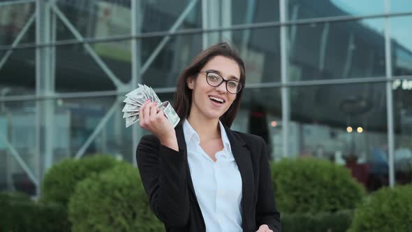 Young Business Lady Holding Money In Her Hands.