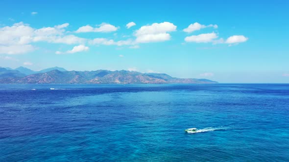 Aerial travel of exotic sea view beach voyage by aqua blue ocean with white sandy background of a da