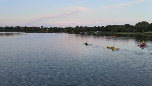 aerial view of group of kayakers enjoying outdoors during summer time in lake of the isles, minneapo
