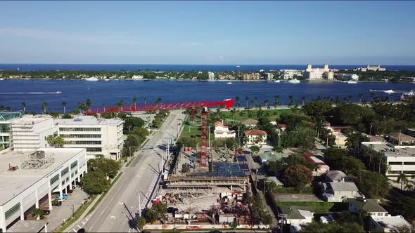 An awesome shot of a tower crane with the intracoastal and ocean in the background.