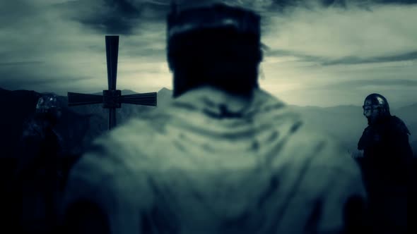 Medieval King Standing In Front Of A Big Cross And Praying