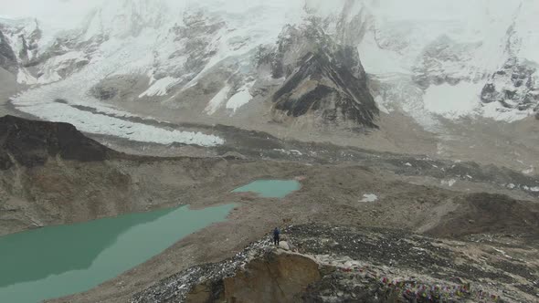 Man on Top of Kalapatthar Mountain. Everest and Nuptse. Nepal. Aerial View