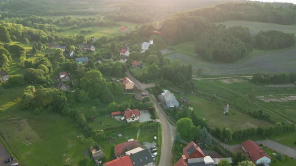 Aerial View of Countryside Area with Village and Mountains