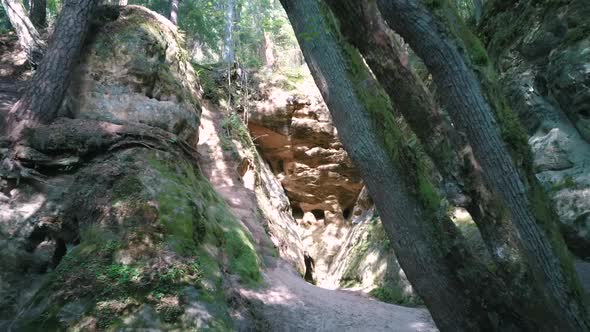 Licu - Langu Sandstone Cliffs. The Big Langu Cave. Sand Formations at Lode Behind Cesis in Latvia. A