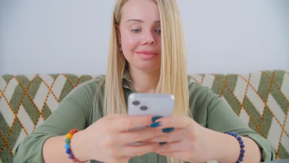 Domestic violence survivor woman browsing new mobile phone for communication online