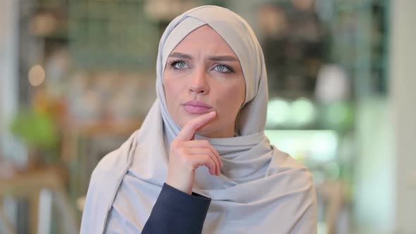 Portrait of Young Arab Woman Thinking About Something