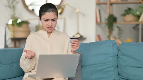 Online Shopping Failure on Laptop By Indian Woman on Sofa