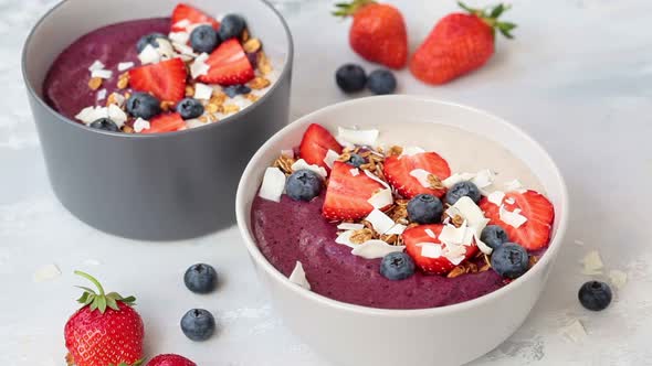 Sprinkle with Coconut Chips Smoothie Bowl with Granola, Berries and Coconut. Healthy Vegan Food