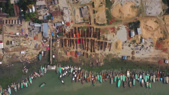 Aerial view of people working in a wood market, Baishmouja, Bangladesh.