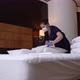 Masked Maid in Gloves Making Bed in Hotel Room - VideoHive Item for Sale