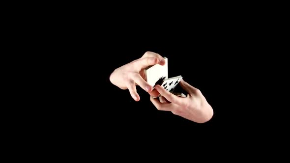 Magician Shuffles the Cards in Unusual Way on Black