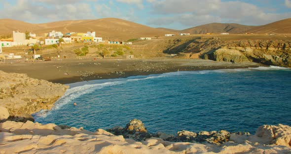 Spain Canary Islands Fuerteventura Sandy Volcanic Beach in Little Town Ajuy