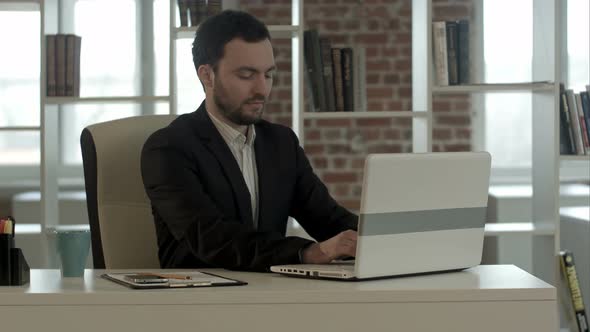 Businessman with Notebook in Office Finished Work, Close Laptop