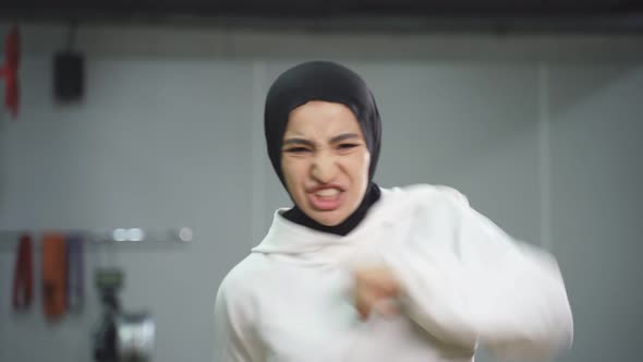 Portrait of a Muslim Woman During a Sports Workout in a Modern Fitness Room