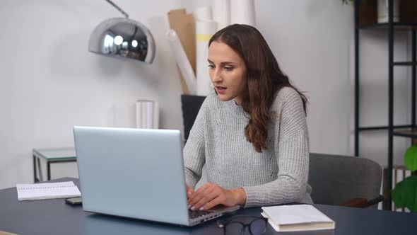 Overjoyed Young Woman Surprised Victory Looks at the Laptop