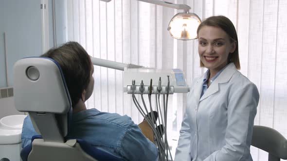 Gorgeous Female Dentist Smiling at Camera