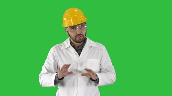 Confident Engineer Man Talking Camera on a Green Screen