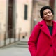 Portrait of smiling woman in red coat outdoors, Pistoia, Tuscany, Italy - VideoHive Item for Sale