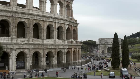 Many Tourists Walking Near Coliseum Amphitheater in Rome, Italy. Sightseeing