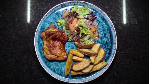 Piece of Grilled Chicken with Fried Potatoes and Salad